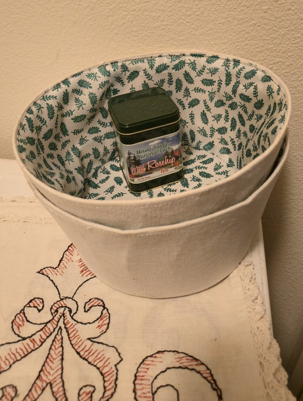 Storage Basket with Green Leaf Lining And Empty Tea Tin
